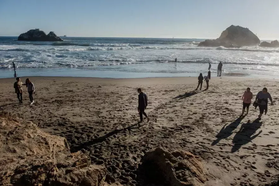 Nick Whittlesey walking on Ocean Beach