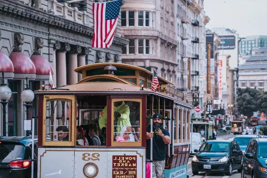 A cable car approaches the camera in Union Square. San Francisco, California.