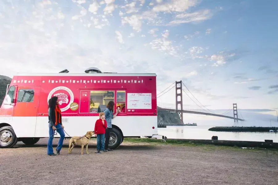 Visitors enjoy ice cream from the Garden Creamery truck.