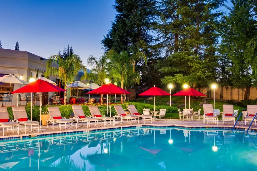 Pool next to outdoor furniture