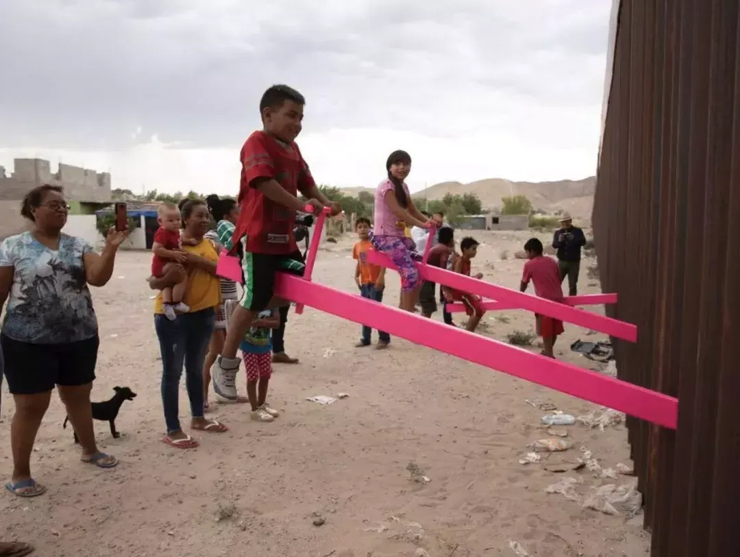 Children riding on pink seesaws 